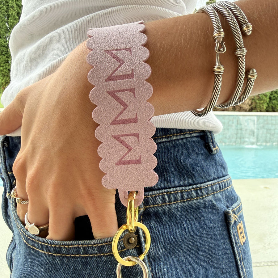 Alpha Chi Omega faux suede wristlet keychain in Beige