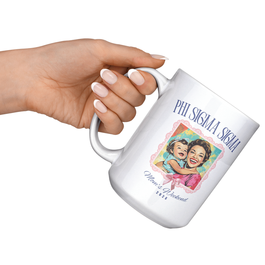 Phi_Sig_Moms_Wkd_Mug_15ozWhiteMugLifestyleLHRaisedAngle_Mockup.png_15422763